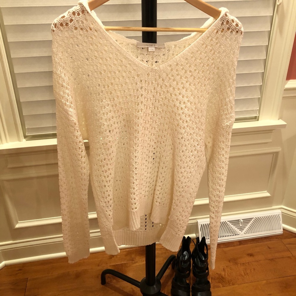 Cream crocheted hooded sweater.